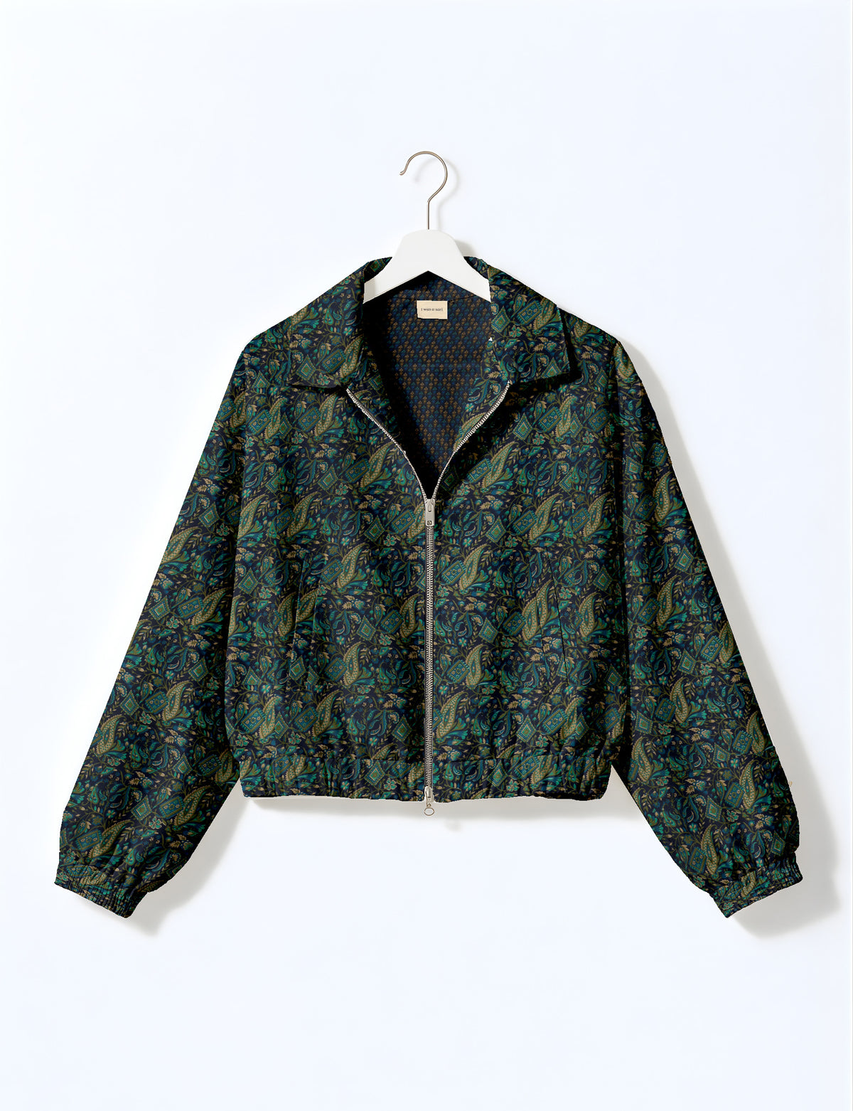 Woman wearing a yellow floral bomber jacket with front zipper, elastic cuffs, and side pockets, shown from front view