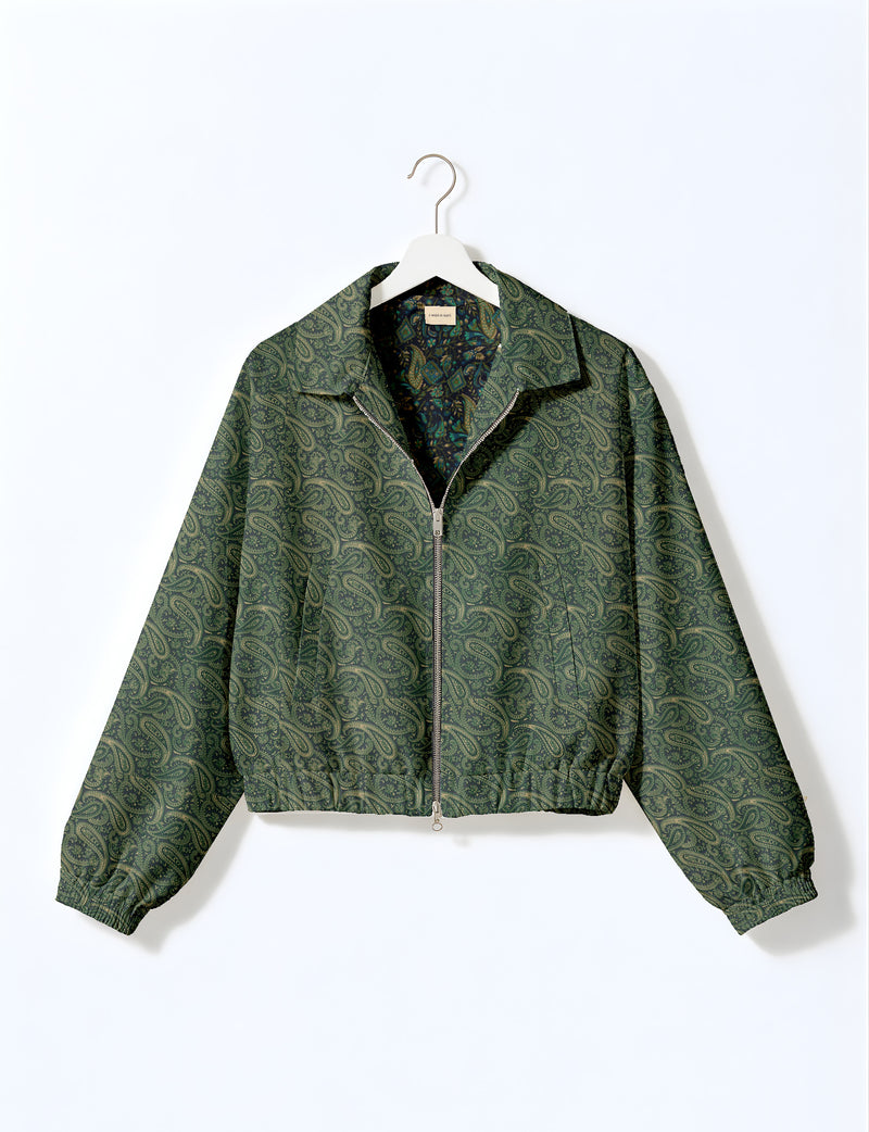 Brown floral bomber jacket with front zipper, elastic cuffs and hem, hanging on white hanger, red floral inner lining visible