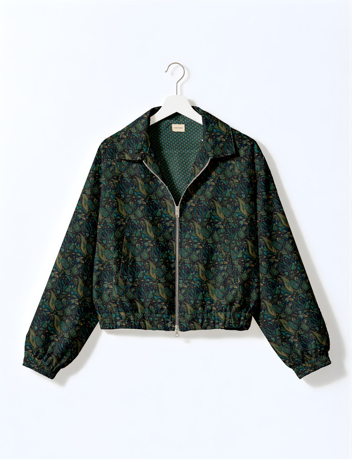 Woman wearing a yellow floral bomber jacket with front zipper, elastic cuffs, and side pockets, shown from front view