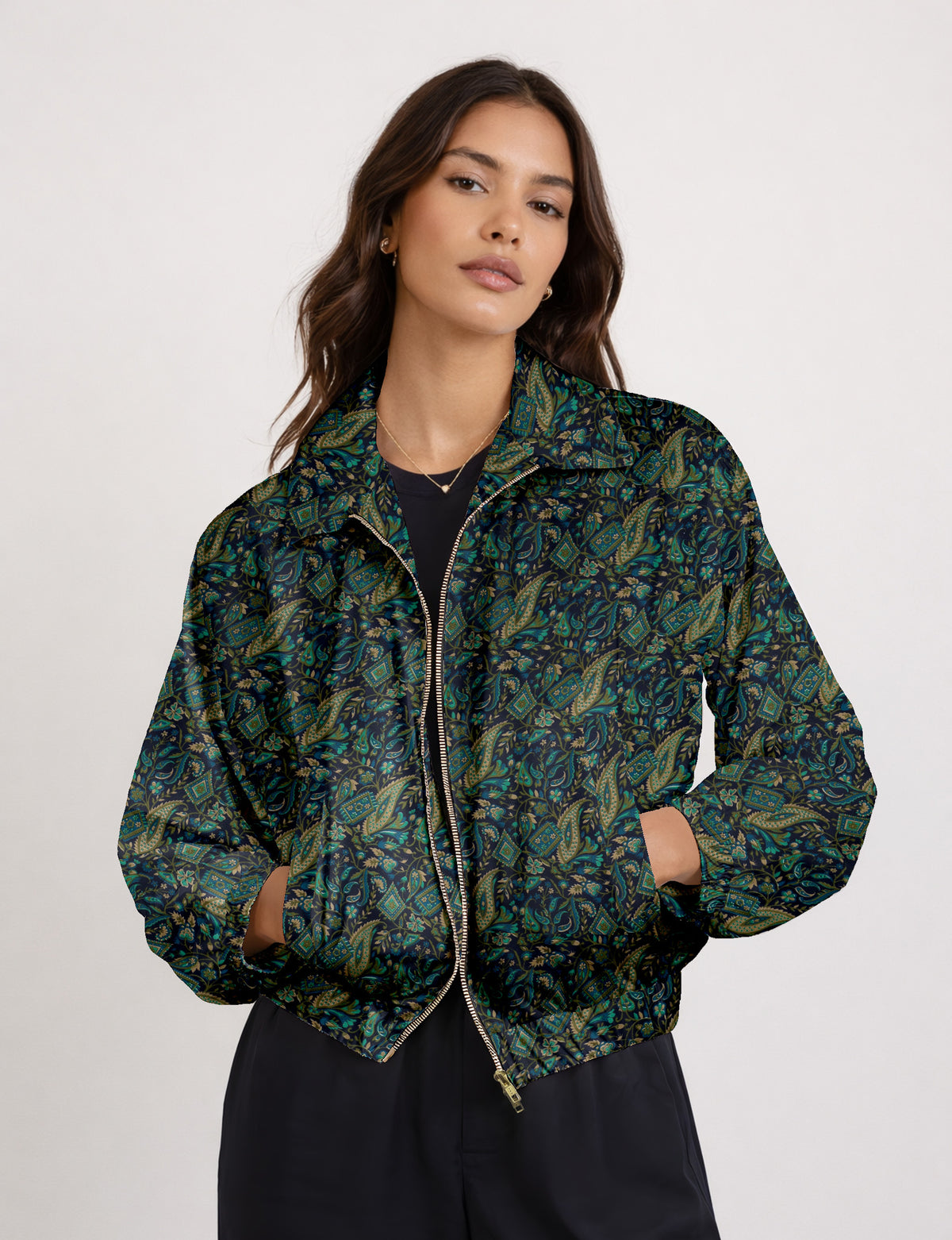 Brown floral bomber jacket with front zipper, elastic cuffs and hem, hanging on white hanger, red floral inner lining visible