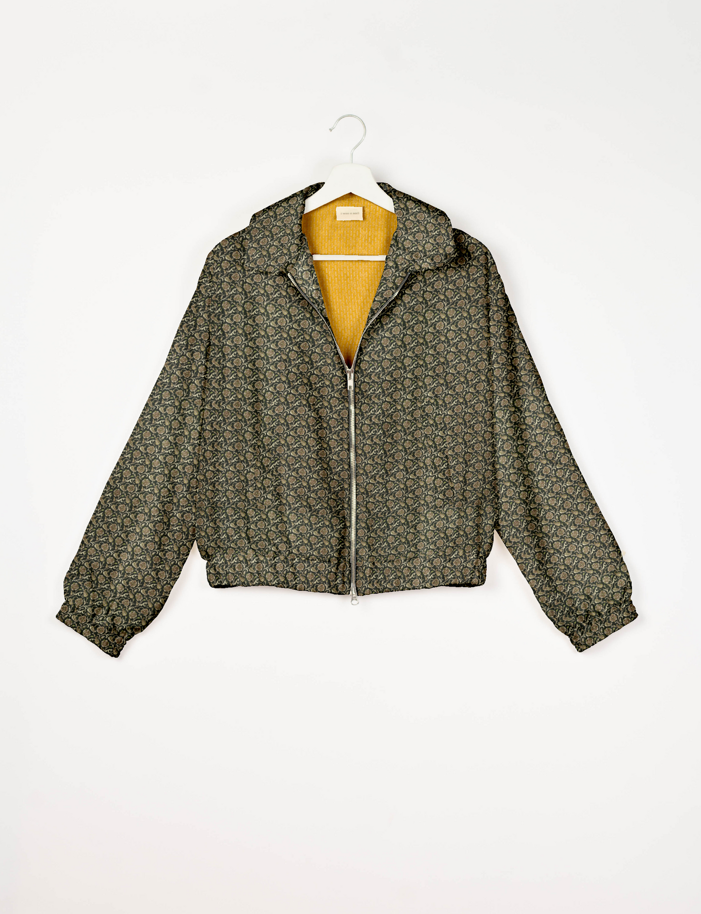 Upcycled Bomber Jacket made from recycled sari materials, featuring a cute cropped shape, elasticated hem and cuffs, and contrast sari print lining. Sustainable apparel promoting eco-friendly fashion and ethical clothing.