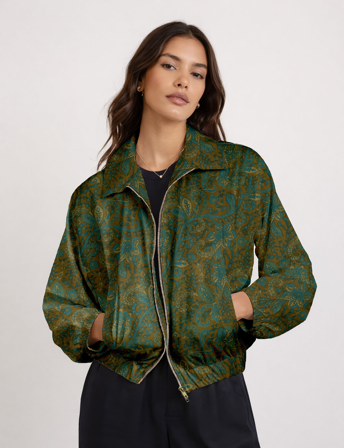 Woman wearing a yellow floral bomber jacket with front zipper, elastic cuffs, and side pockets, shown from front view