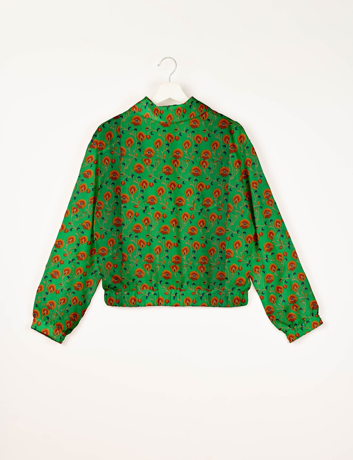 Upcycled Bomber Jacket made from recycled sari materials, featuring a cute cropped shape, elasticated hem and cuffs, and contrast sari print lining. Sustainable apparel promoting eco-friendly fashion and ethical clothing.