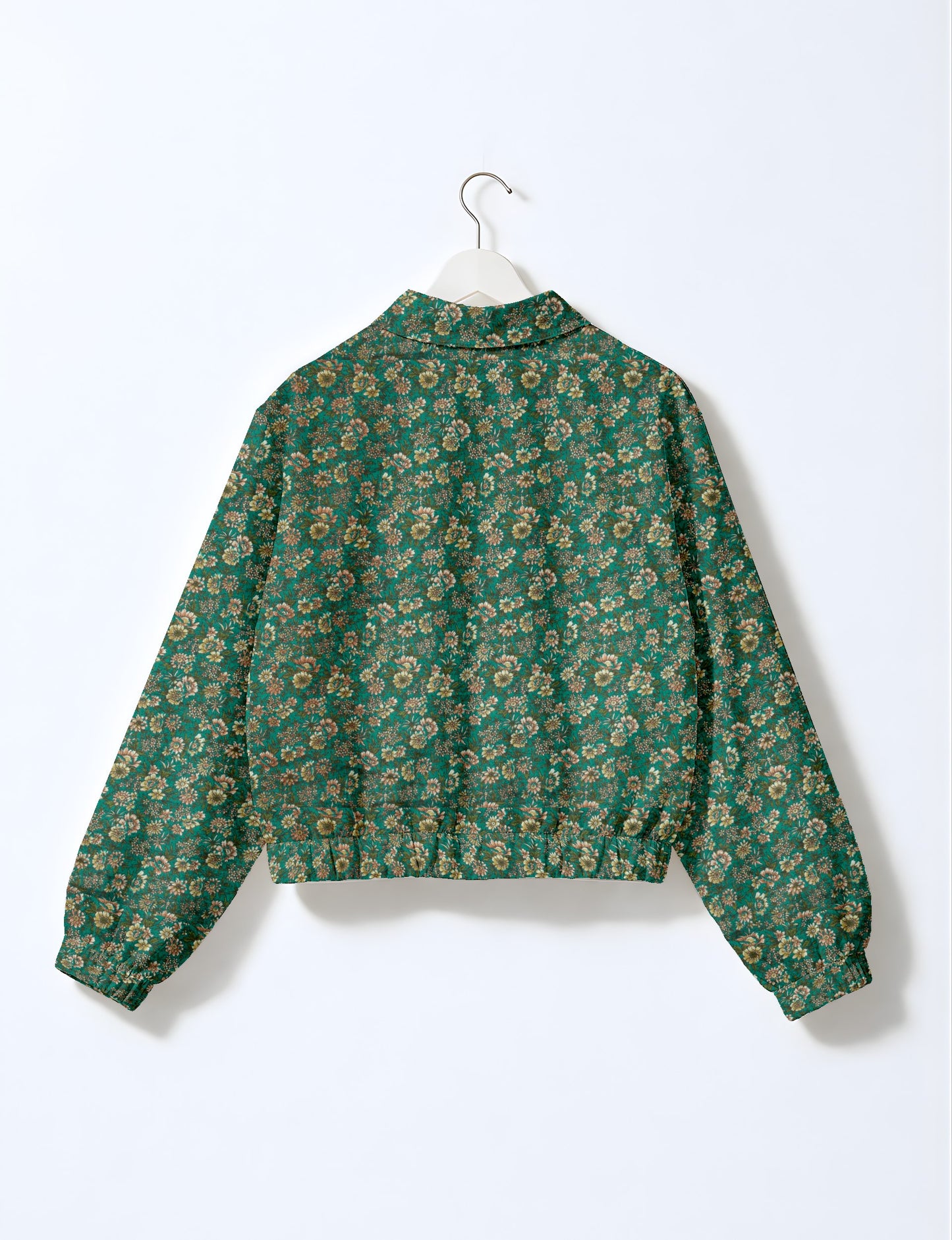 Upcycled Bomber Jacket made from recycled sari materials, featuring a cute cropped shape, elasticated hem and cuffs, and contrast sari print lining. Sustainable apparel promoting eco-friendly fashion and ethical clothing.