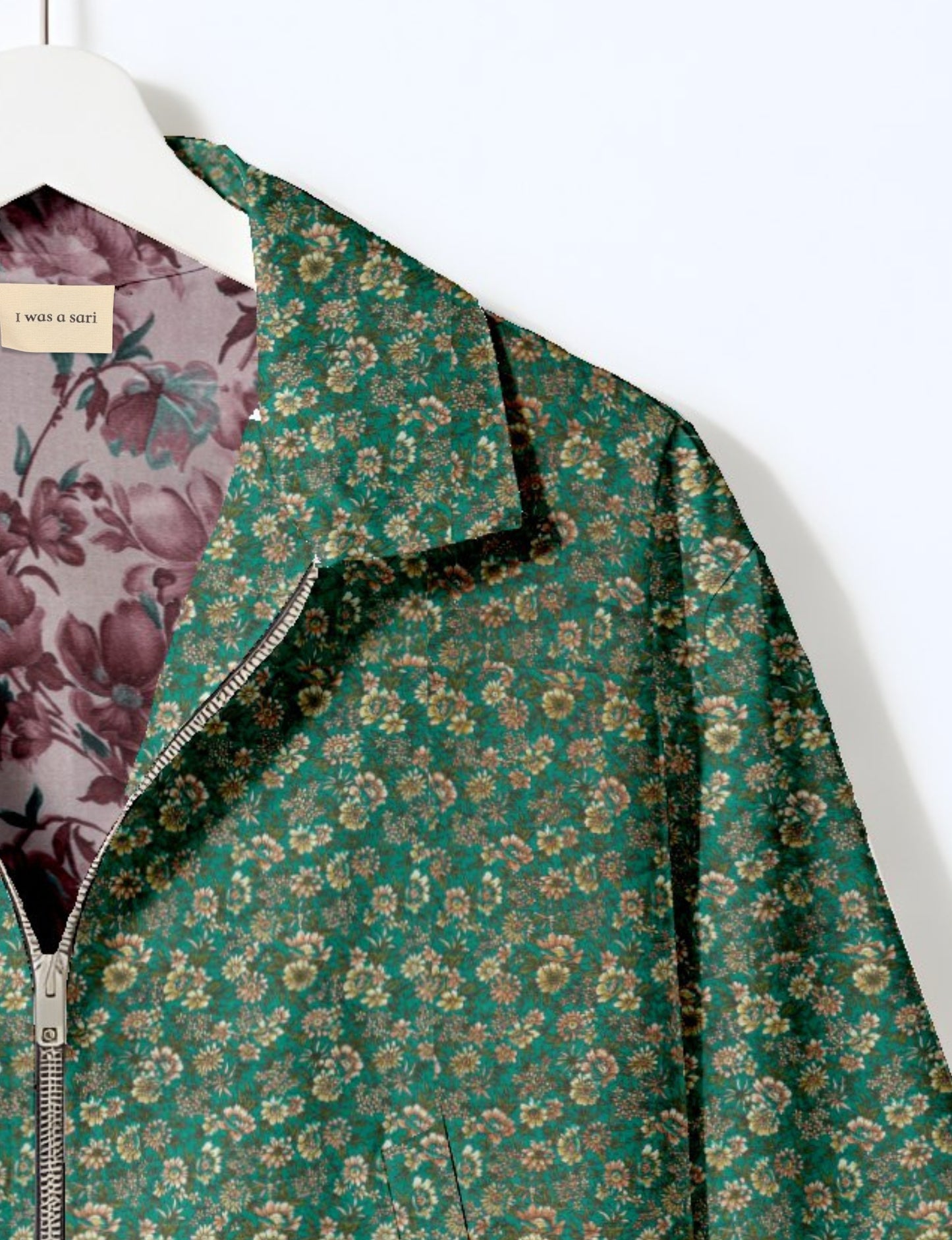 Upcycled Bomber Jacket made from recycled sari materials, featuring a cute cropped shape, elasticated hem and cuffs, and contrast sari print lining. Sustainable apparel promoting eco-friendly fashion and ethical clothing.