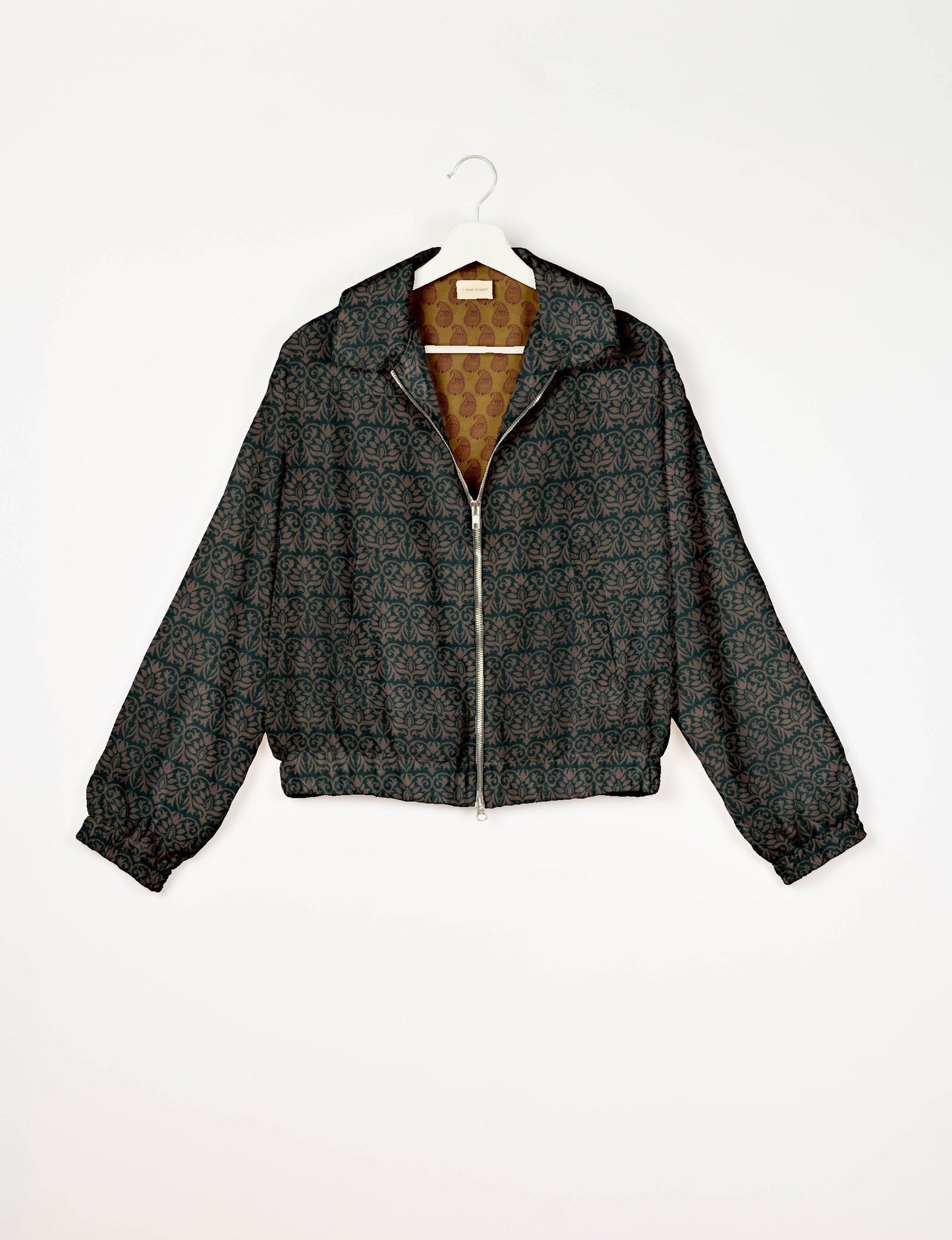 Upcycled Bomber Jacket made from recycled sari materials, featuring a cute cropped shape, elasticated hem and cuffs, and contrast sari print lining. Sustainable apparel promoting eco-friendly fashion and ethical clothing.