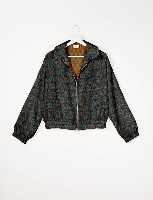 Upcycled Bomber Jacket made from recycled sari materials, featuring a cute cropped shape, elasticated hem and cuffs, and contrast sari print lining. Sustainable apparel promoting eco-friendly fashion and ethical clothing.