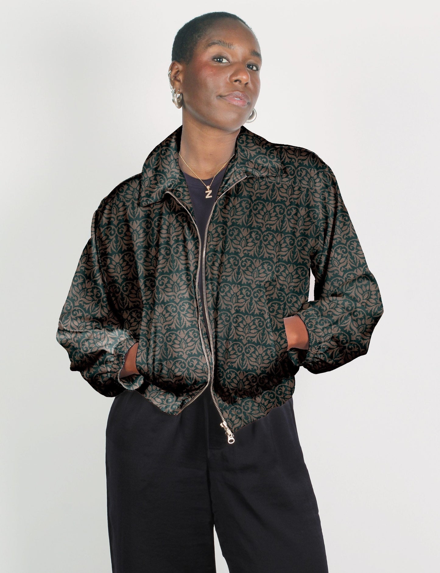 Upcycled Bomber Jacket made from recycled sari materials, featuring a cute cropped shape, elasticated hem and cuffs, and contrast sari print lining. Sustainable apparel promoting eco-friendly fashion and ethical clothing.