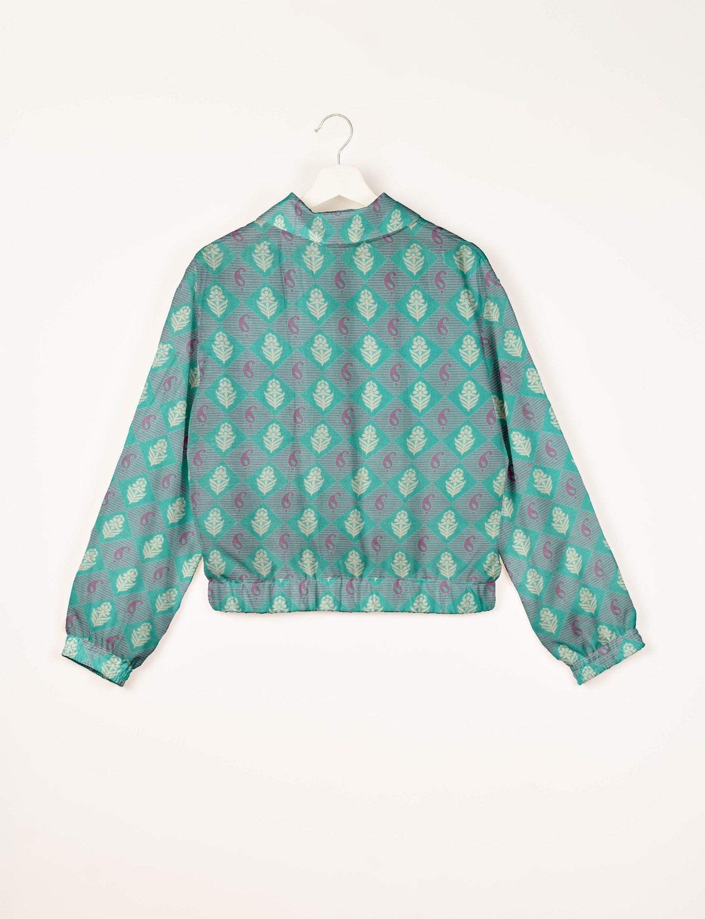 Upcycled Bomber Jacket made from recycled sari materials, featuring a cute cropped shape, elasticated hem and cuffs, and contrast sari print lining. Sustainable apparel promoting eco-friendly fashion and ethical clothing.