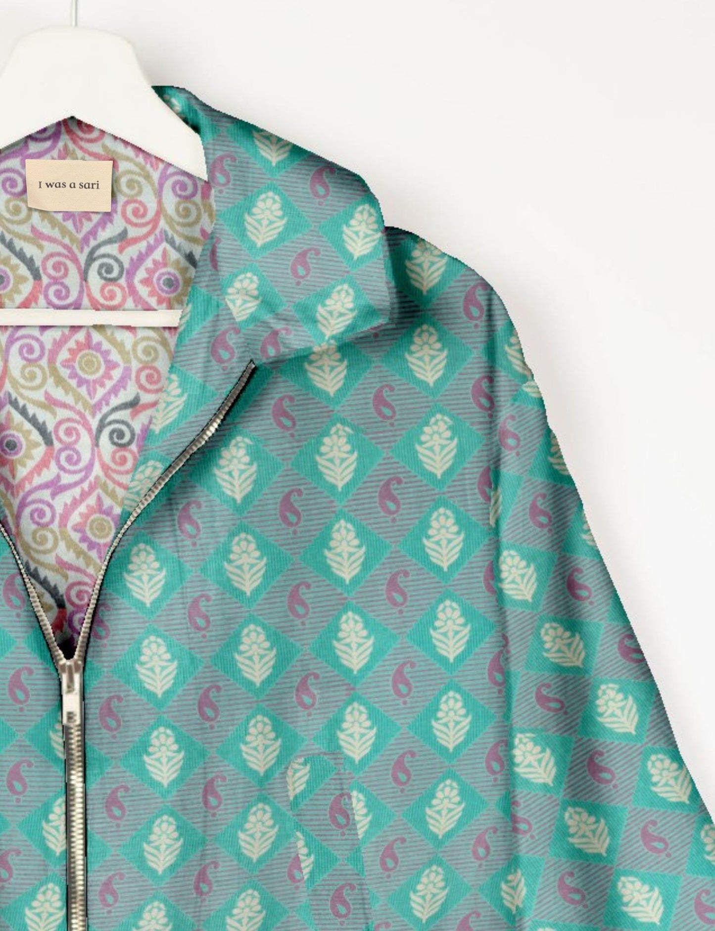 Upcycled Bomber Jacket made from recycled sari materials, featuring a cute cropped shape, elasticated hem and cuffs, and contrast sari print lining. Sustainable apparel promoting eco-friendly fashion and ethical clothing.