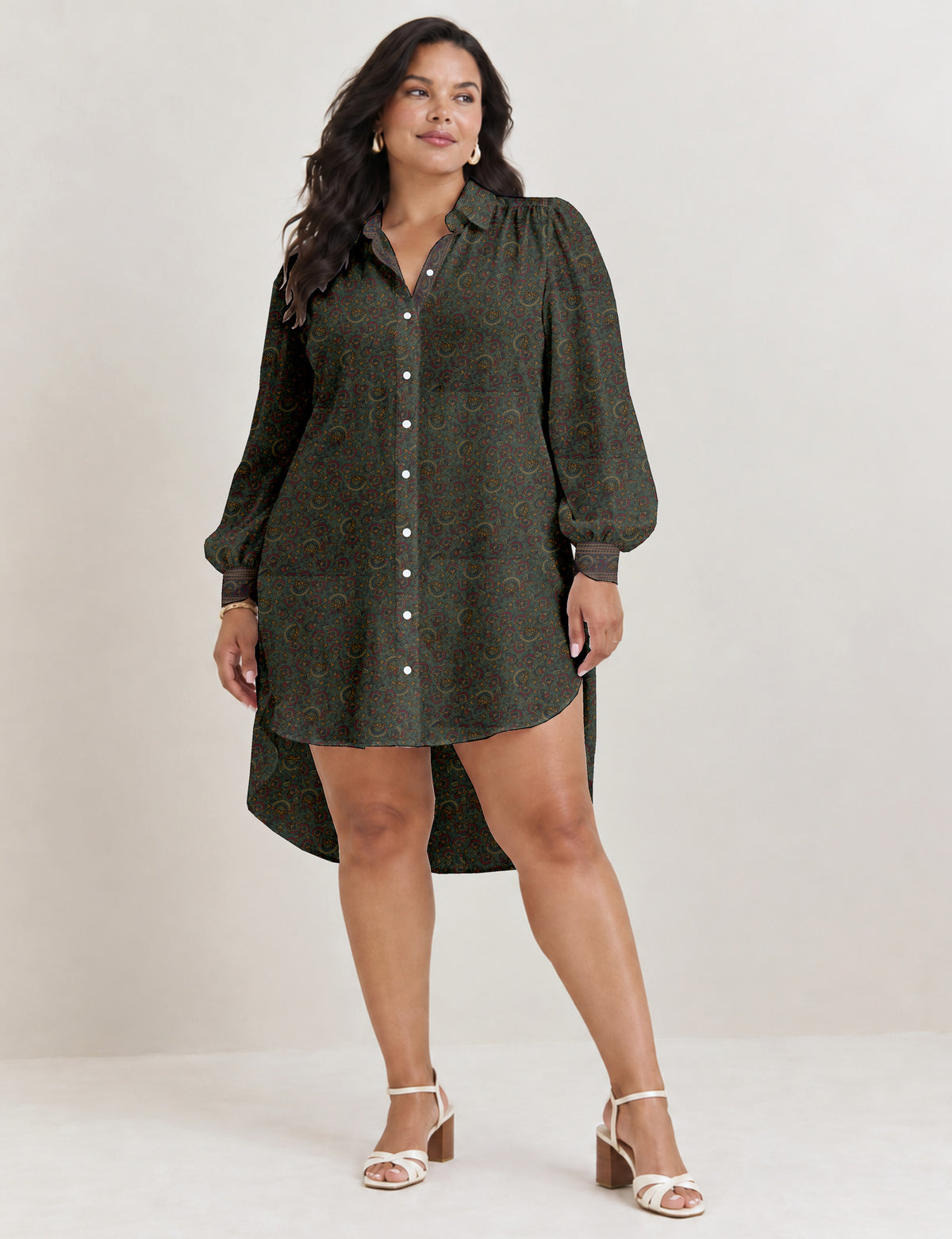 High low shirt with a relaxed fit, button-down front, classic collar, gathered shoulders and full-length blouson sleeves.