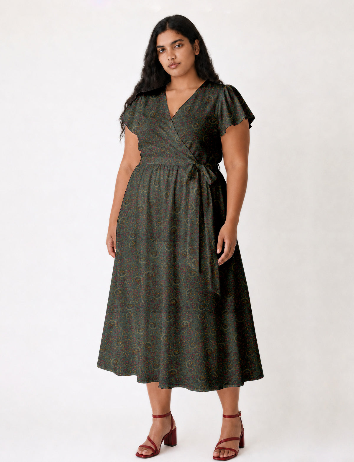 Elegant midi wrap dress with a V-neckline, adjustable waist tie, fitted bodice, and flared skirt for a timeless, flattering silhouette.