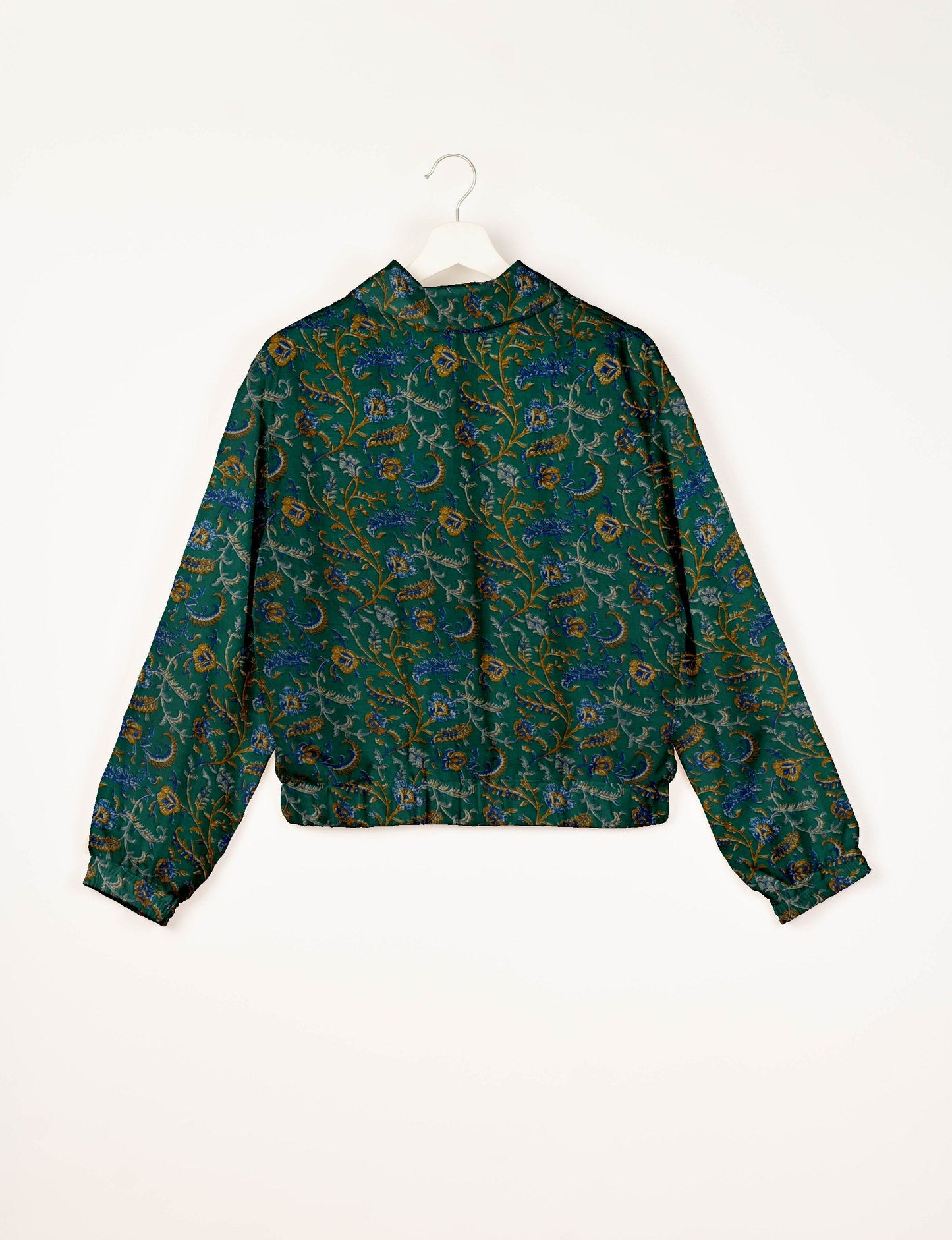Upcycled Bomber Jacket made from recycled sari materials, featuring a cute cropped shape, elasticated hem and cuffs, and contrast sari print lining. Sustainable apparel promoting eco-friendly fashion and ethical clothing.