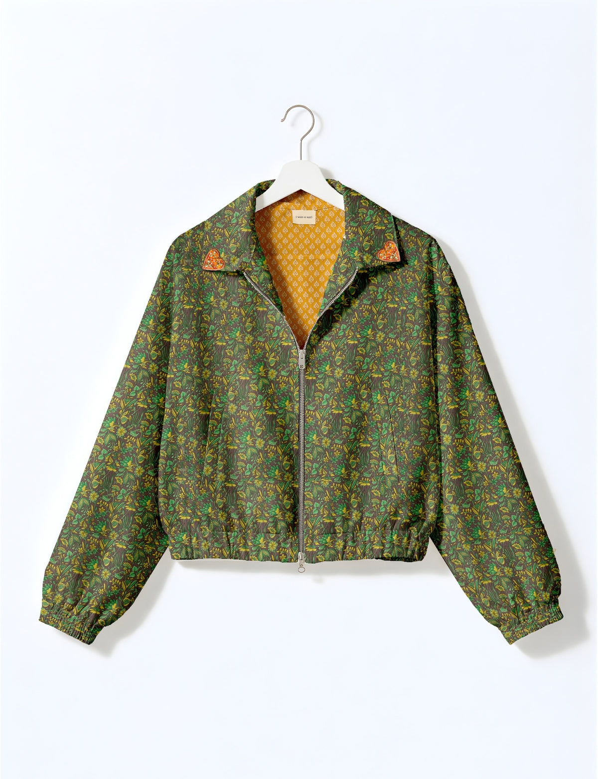 Love Bomber Jacket made from recycled fabric, featuring hand-stitched Aari embroidery. A unique piece of zero-waste clothing, part of the circular fashion movement. Designed with upcycled materials for a stylish yet environmentally friendly clothing choice.