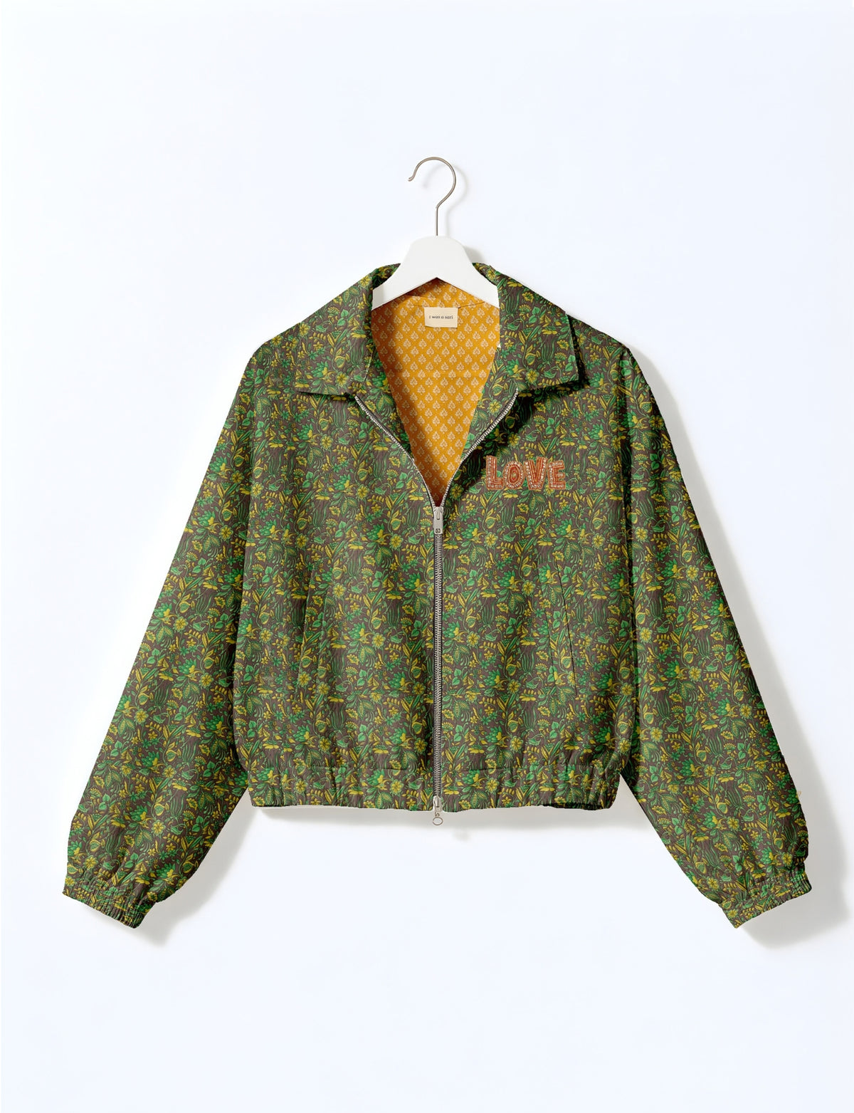 Love Bomber Jacket made from recycled fabric, featuring hand-stitched Aari embroidery. A unique piece of zero-waste clothing, part of the circular fashion movement. Designed with upcycled materials for a stylish yet environmentally friendly clothing choice.