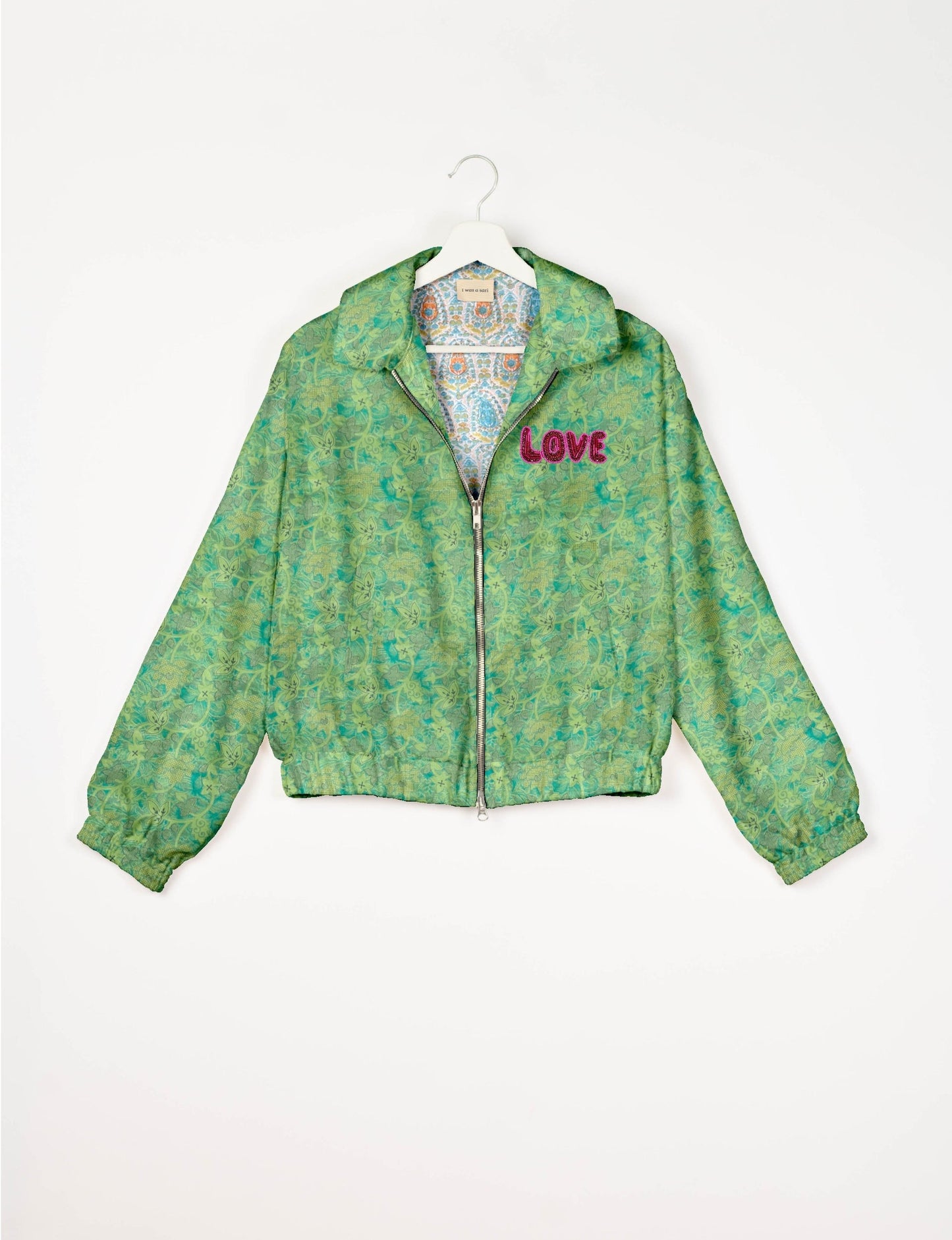 Love Bomber Jacket made from recycled fabric, featuring hand-stitched Aari embroidery. A unique piece of zero-waste clothing, part of the circular fashion movement. Designed with upcycled materials for a stylish yet environmentally friendly clothing choice.