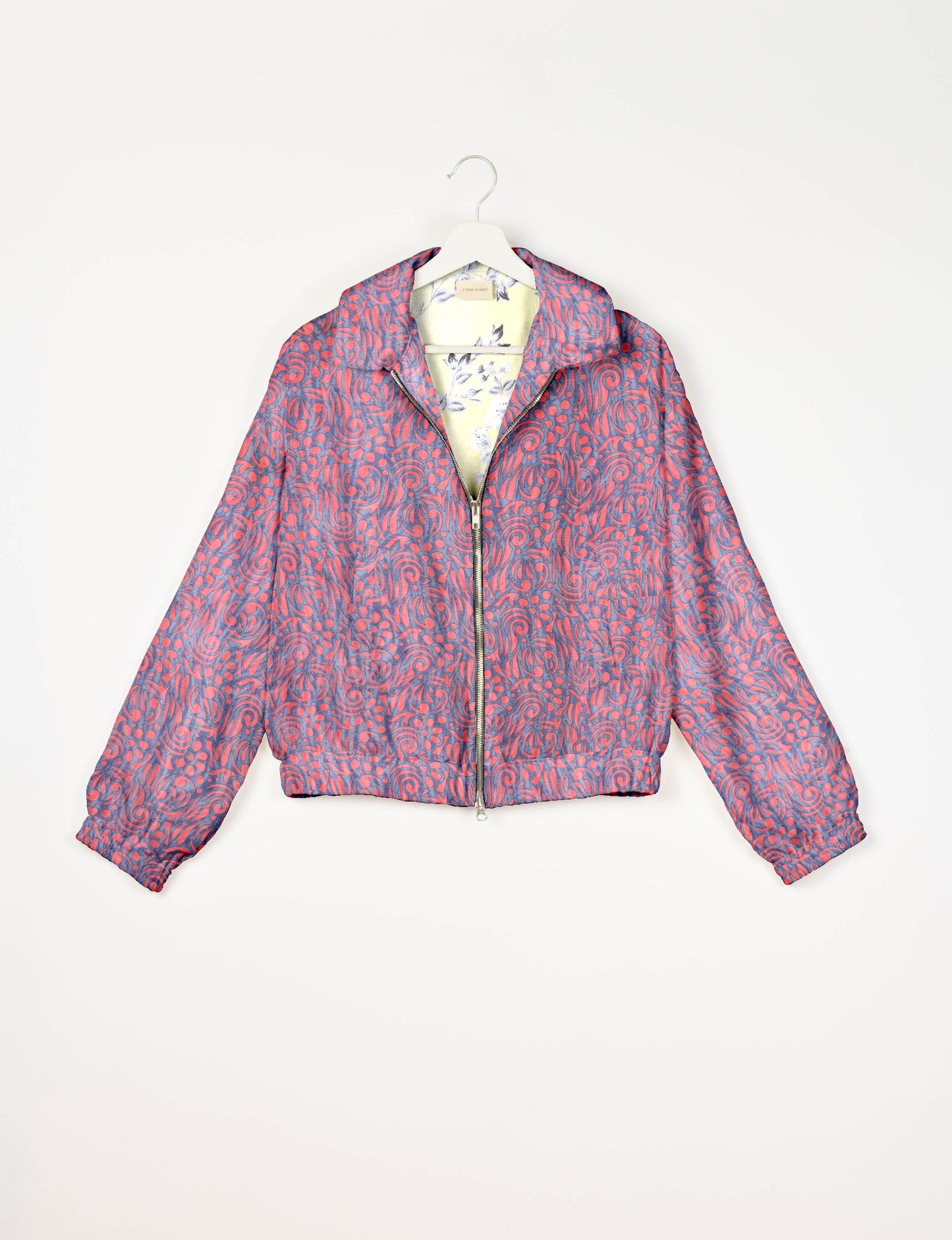 Upcycled Bomber Jacket made from recycled sari materials, featuring a cute cropped shape, elasticated hem and cuffs, and contrast sari print lining. Sustainable apparel promoting eco-friendly fashion and ethical clothing.