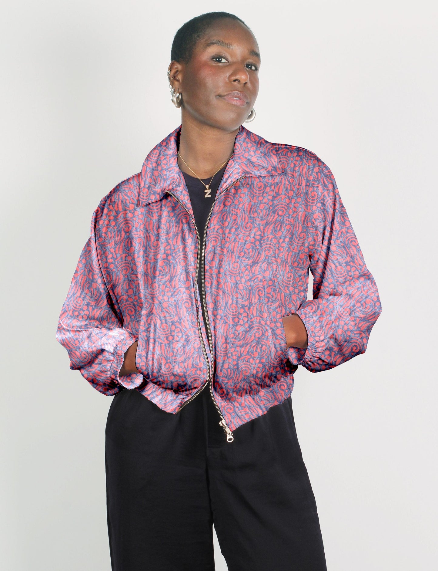 Upcycled Bomber Jacket made from recycled sari materials, featuring a cute cropped shape, elasticated hem and cuffs, and contrast sari print lining. Sustainable apparel promoting eco-friendly fashion and ethical clothing.