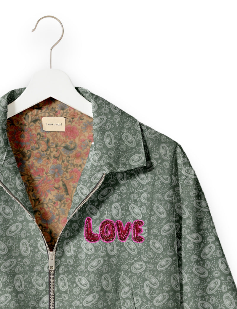 Love Bomber Jacket made from recycled fabric, featuring hand-stitched Aari embroidery. A unique piece of zero-waste clothing, part of the circular fashion movement. Designed with upcycled materials for a stylish yet environmentally friendly clothing choice.