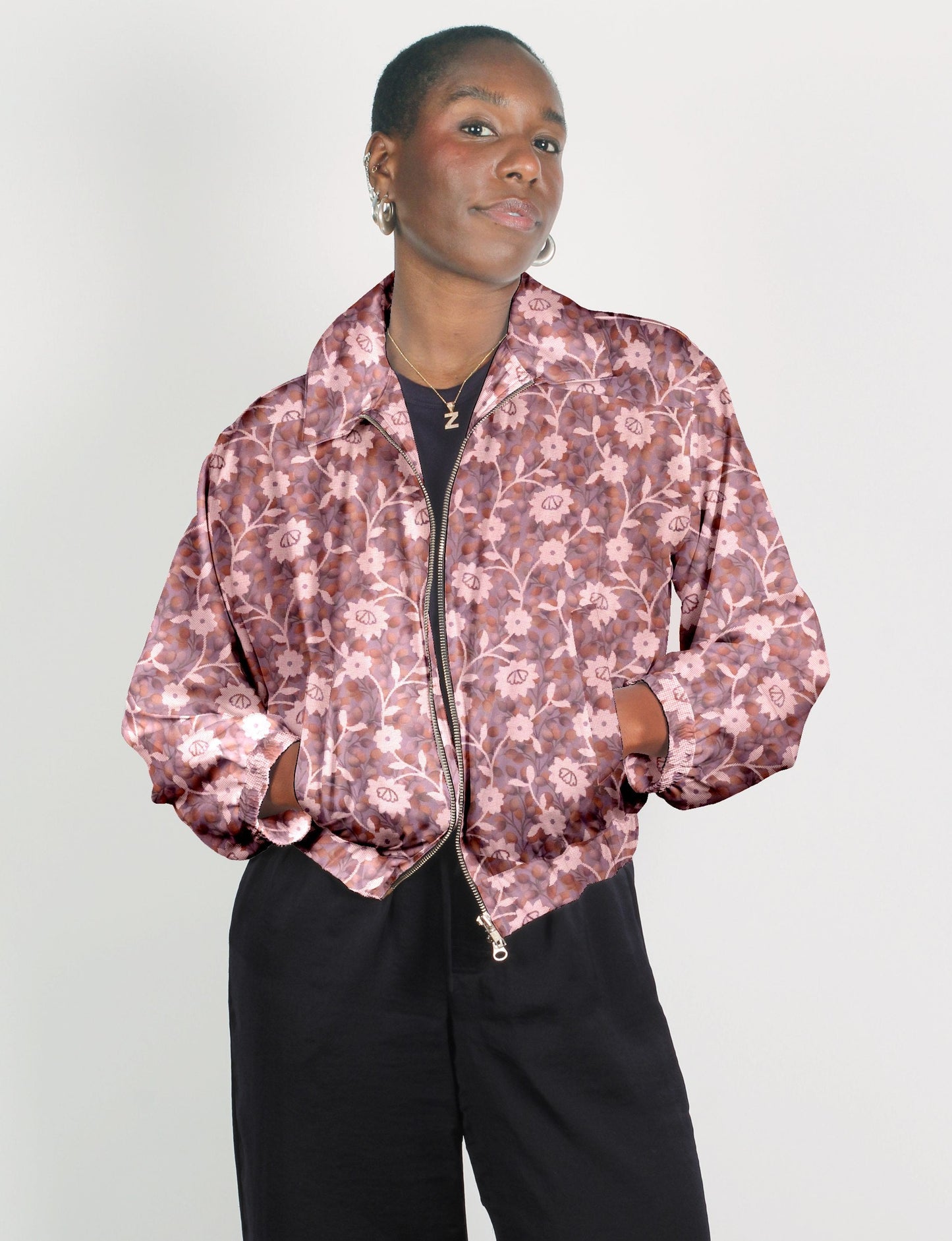 Stylish BOMBER JACKET, an upcycled clothing masterpiece with a cute cropped shape, elasticated details, and detachable metallic zipper. Contrast sari print lining adds a unique touch. Explore sustainable and eco-friendly fashion.