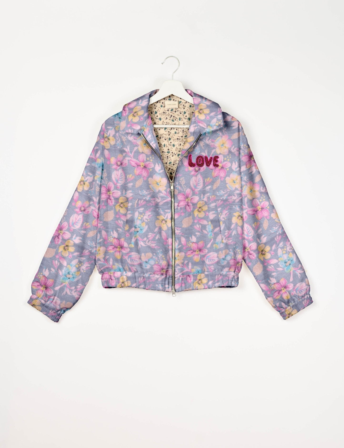 Love Bomber Jacket made from recycled fabric, featuring hand-stitched Aari embroidery. A unique piece of zero-waste clothing, part of the circular fashion movement. Designed with upcycled materials for a stylish yet environmentally friendly clothing choice.