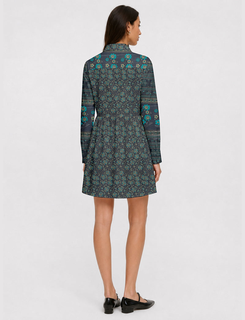 Short shirt dress with a relaxed A-line silhouette, point collar, partial button placket, gathered waist, side pockets, and full-length cuffed sleeves.