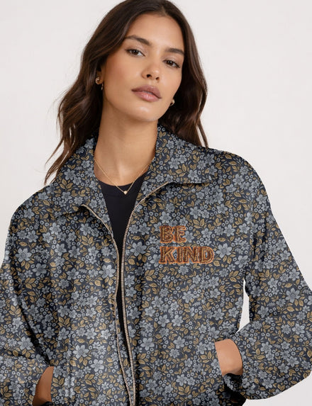 BE KIND Bomber jacket made from upcycled sari fabric with handcrafted Aari embroidery by female artisans.