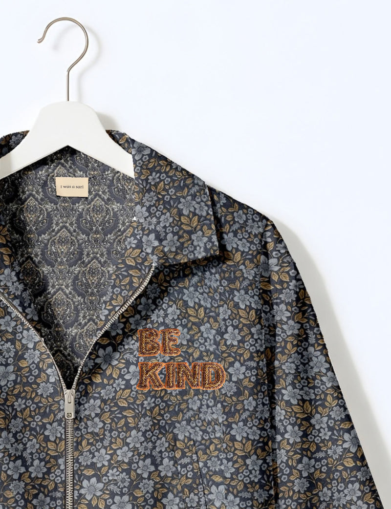 BE KIND Bomber jacket made from upcycled sari fabric with handcrafted Aari embroidery by female artisans.