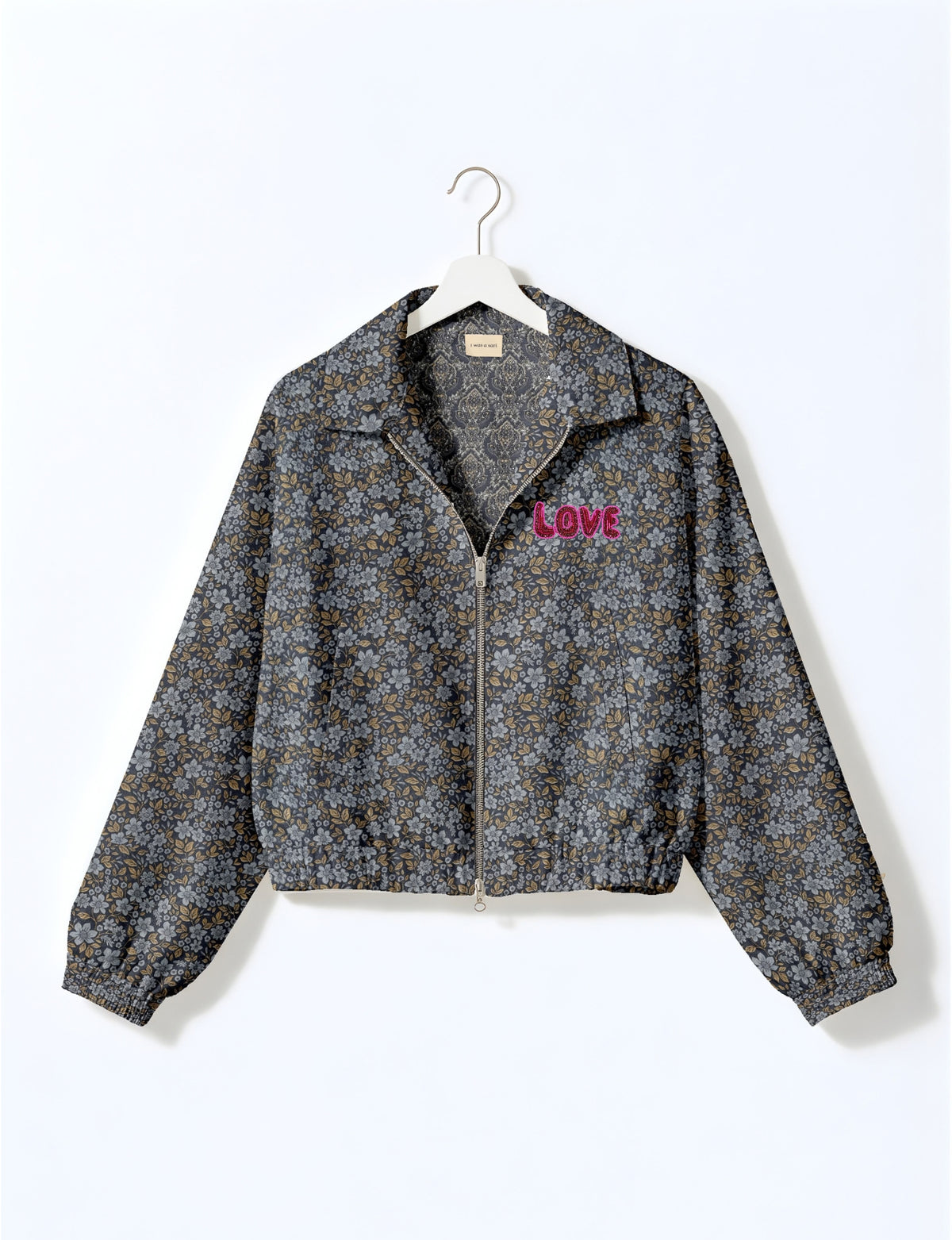 Love Bomber Jacket made from recycled fabric, featuring hand-stitched Aari embroidery. A unique piece of zero-waste clothing, part of the circular fashion movement. Designed with upcycled materials for a stylish yet environmentally friendly clothing choice.