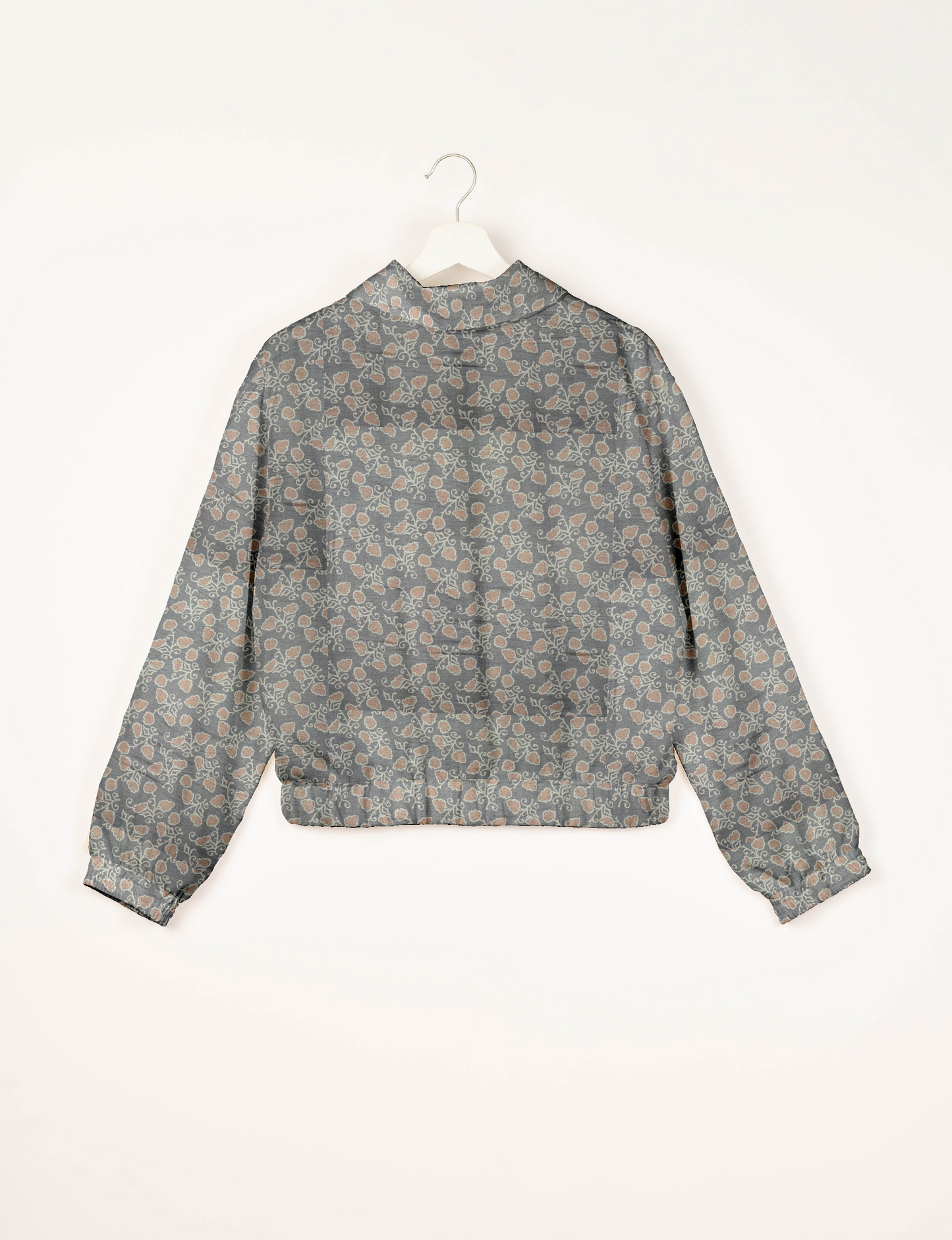 Upcycled Bomber Jacket made from recycled sari materials, featuring a cute cropped shape, elasticated hem and cuffs, and contrast sari print lining. Sustainable apparel promoting eco-friendly fashion and ethical clothing.