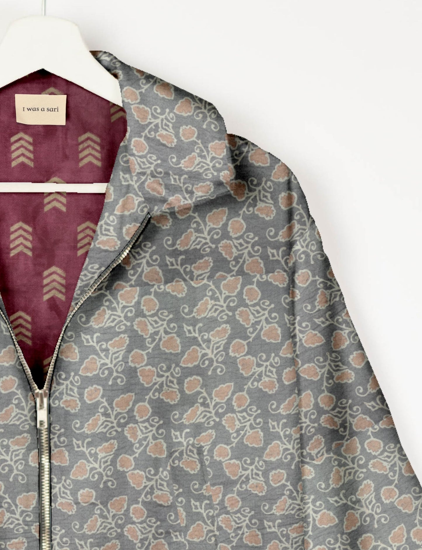 Upcycled Bomber Jacket made from recycled sari materials, featuring a cute cropped shape, elasticated hem and cuffs, and contrast sari print lining. Sustainable apparel promoting eco-friendly fashion and ethical clothing.