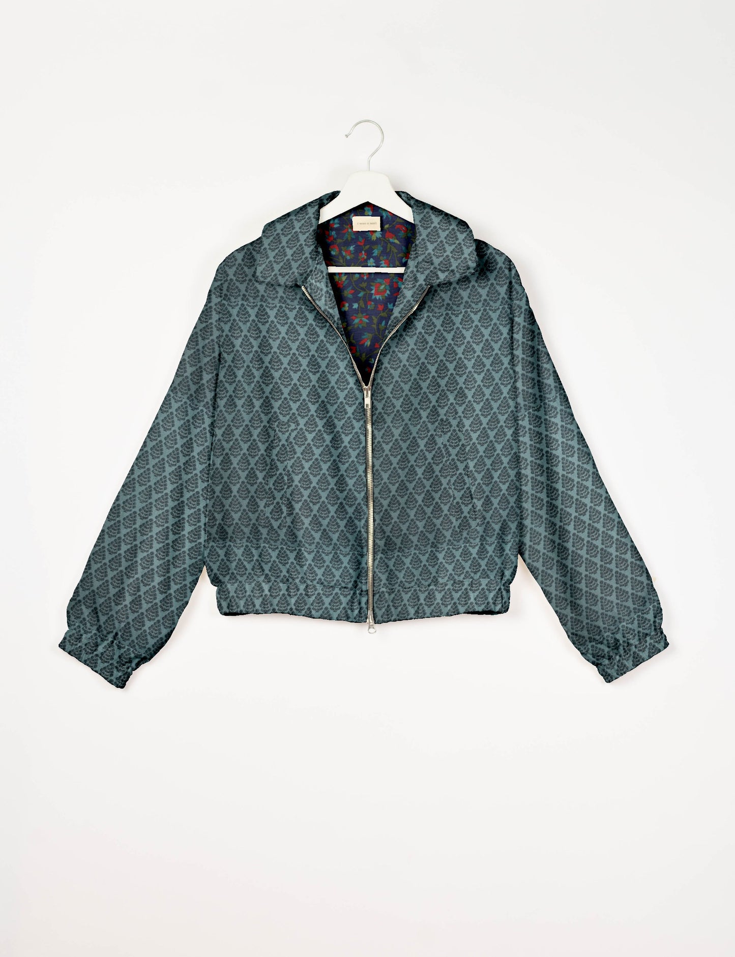 Upcycled Bomber Jacket made from recycled sari materials, featuring a cute cropped shape, elasticated hem and cuffs, and contrast sari print lining. Sustainable apparel promoting eco-friendly fashion and ethical clothing.