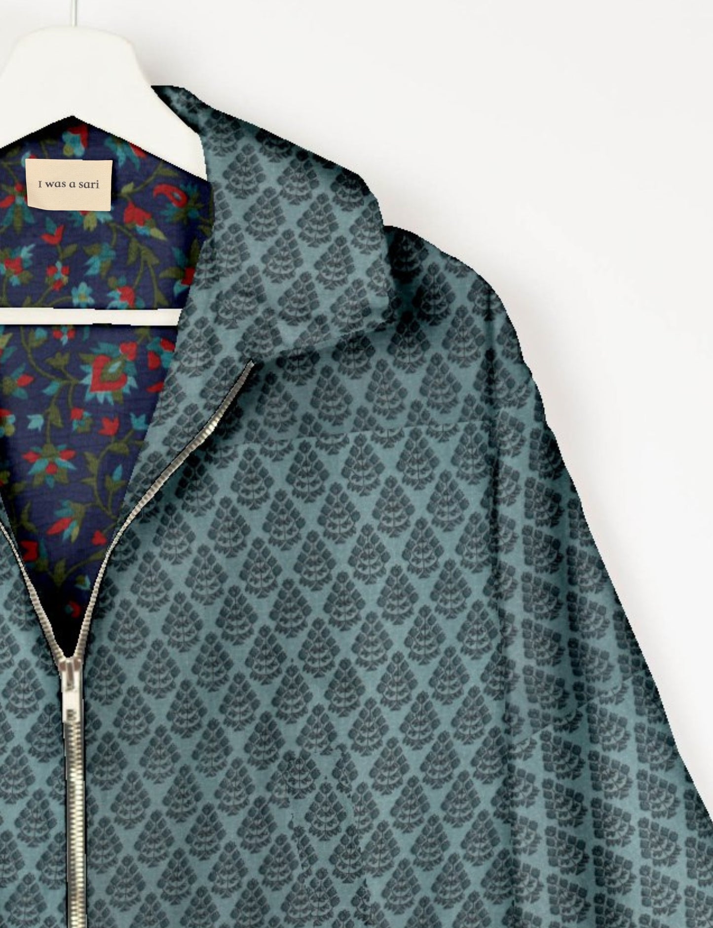 Upcycled Bomber Jacket made from recycled sari materials, featuring a cute cropped shape, elasticated hem and cuffs, and contrast sari print lining. Sustainable apparel promoting eco-friendly fashion and ethical clothing.