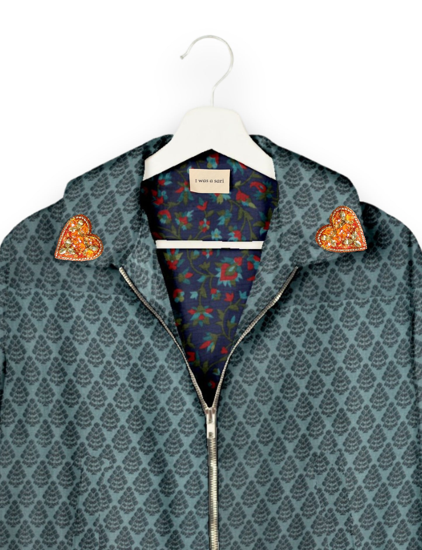 Make a bold statement with our Heart Drop Earrings, a symbol of conscious luxury and ethical fashion. Handcrafted using the intricate Aari embroidery technique, these earrings are made from upcycled sari fabric, embracing slow fashion and zero waste clothing. Elevate your look with sustainable apparel that supports fair trade fashion while reducing textile waste. Choose eco-friendly fashion that speaks of love, artistry, and responsibility.