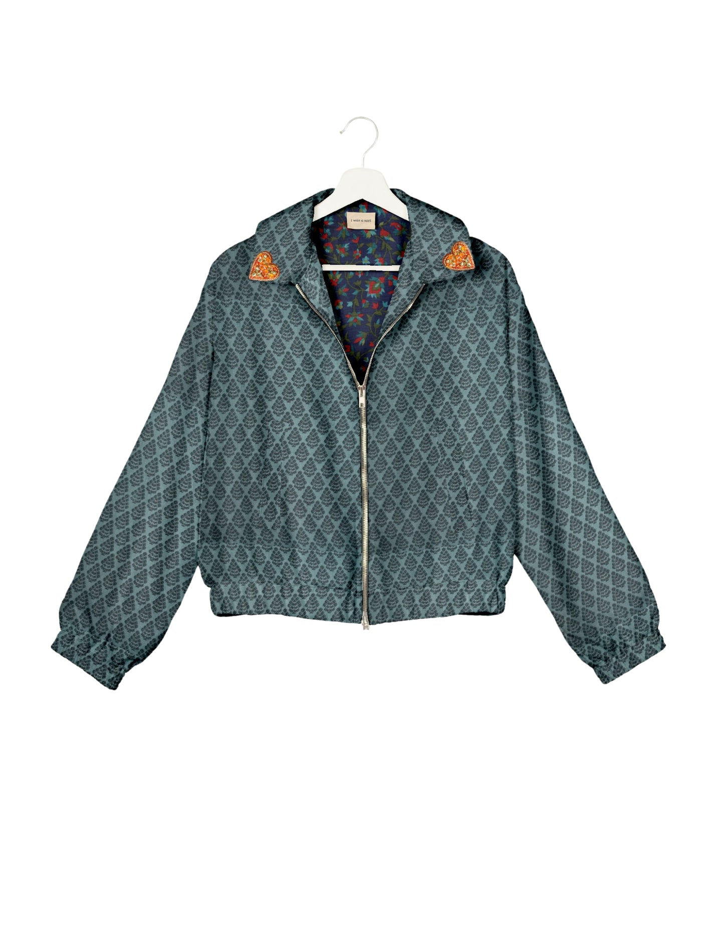 Make a bold statement with our Heart Drop Earrings, a symbol of conscious luxury and ethical fashion. Handcrafted using the intricate Aari embroidery technique, these earrings are made from upcycled sari fabric, embracing slow fashion and zero waste clothing. Elevate your look with sustainable apparel that supports fair trade fashion while reducing textile waste. Choose eco-friendly fashion that speaks of love, artistry, and responsibility.