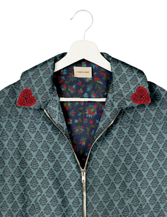 Make a bold statement with our Heart Drop Earrings, a symbol of conscious luxury and ethical fashion. Handcrafted using the intricate Aari embroidery technique, these earrings are made from upcycled sari fabric, embracing slow fashion and zero waste clothing. Elevate your look with sustainable apparel that supports fair trade fashion while reducing textile waste. Choose eco-friendly fashion that speaks of love, artistry, and responsibility.