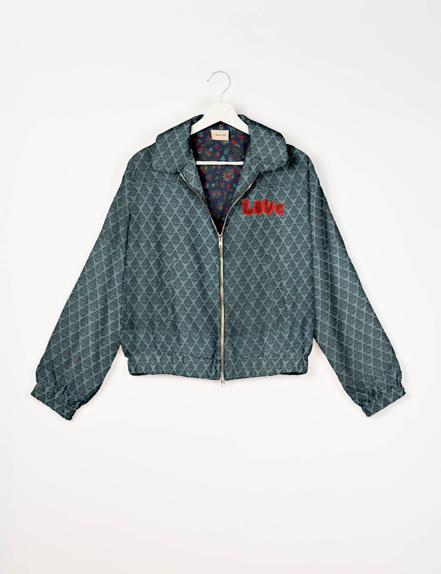 Love Bomber Jacket made from recycled fabric, featuring hand-stitched Aari embroidery. A unique piece of zero-waste clothing, part of the circular fashion movement. Designed with upcycled materials for a stylish yet environmentally friendly clothing choice.