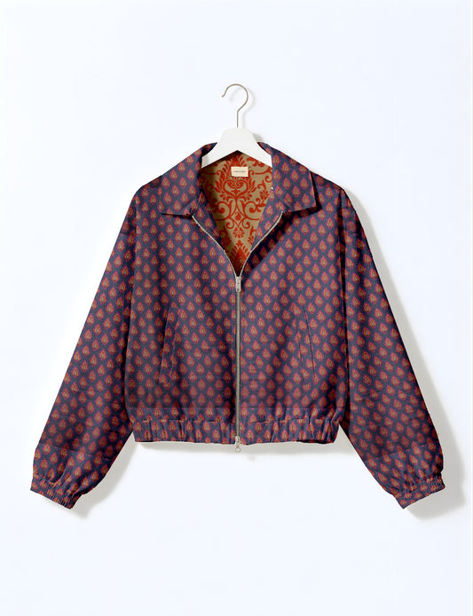 Upcycled Bomber Jacket made from recycled sari materials, featuring a cute cropped shape, elasticated hem and cuffs, and contrast sari print lining. Sustainable apparel promoting eco-friendly fashion and ethical clothing.