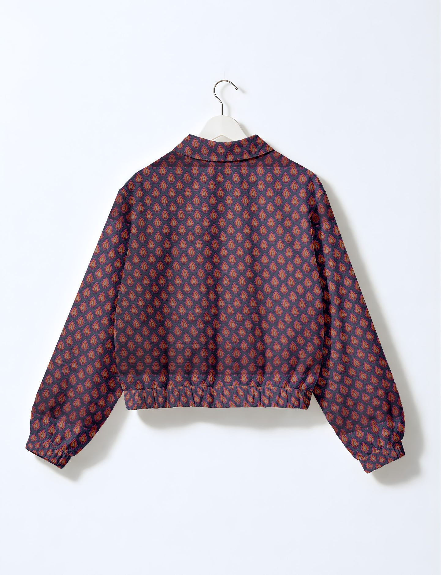 Upcycled Bomber Jacket made from recycled sari materials, featuring a cute cropped shape, elasticated hem and cuffs, and contrast sari print lining. Sustainable apparel promoting eco-friendly fashion and ethical clothing.