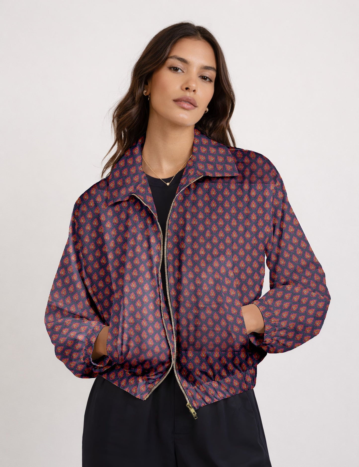 Upcycled Bomber Jacket made from recycled sari materials, featuring a cute cropped shape, elasticated hem and cuffs, and contrast sari print lining. Sustainable apparel promoting eco-friendly fashion and ethical clothing.