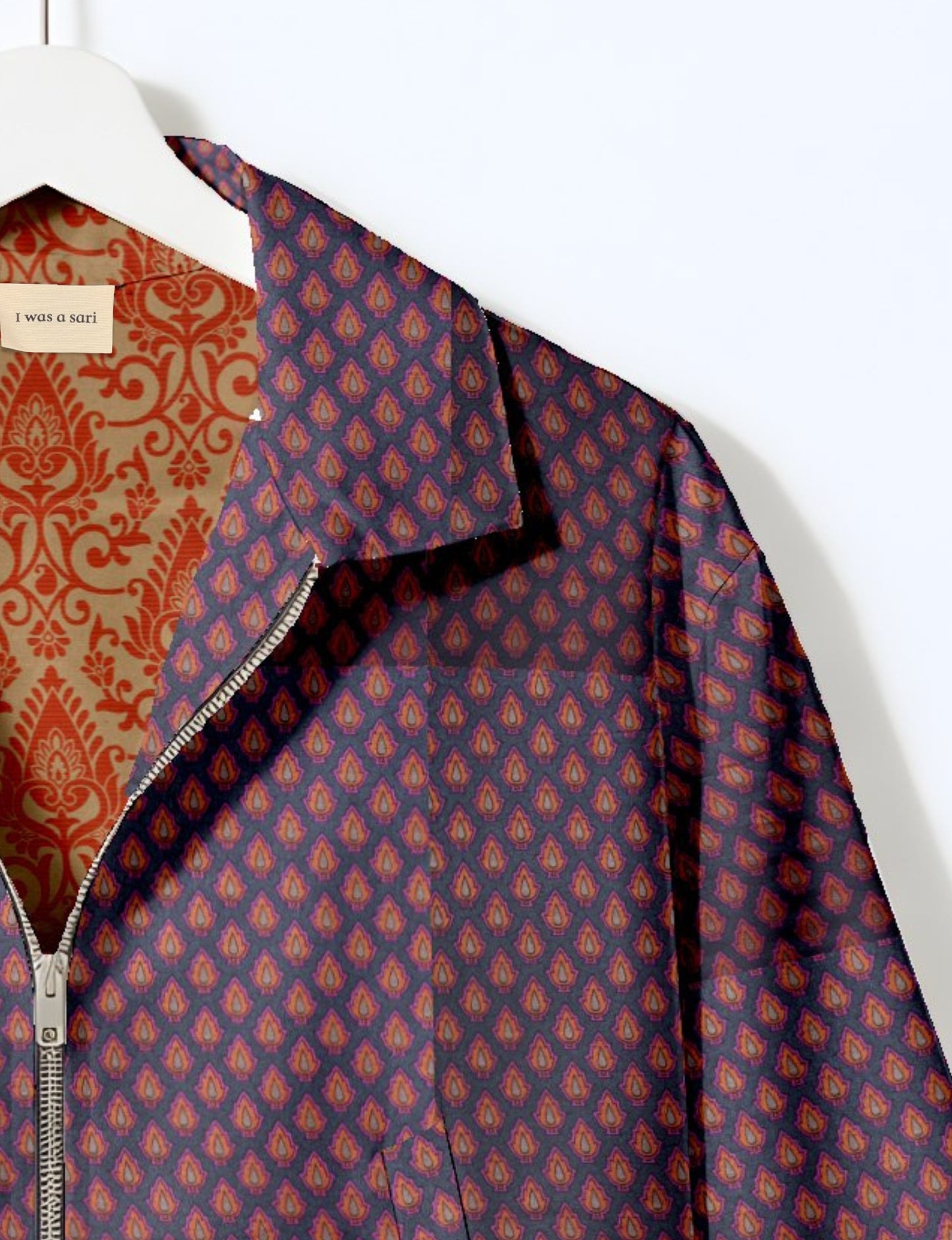 Upcycled Bomber Jacket made from recycled sari materials, featuring a cute cropped shape, elasticated hem and cuffs, and contrast sari print lining. Sustainable apparel promoting eco-friendly fashion and ethical clothing.