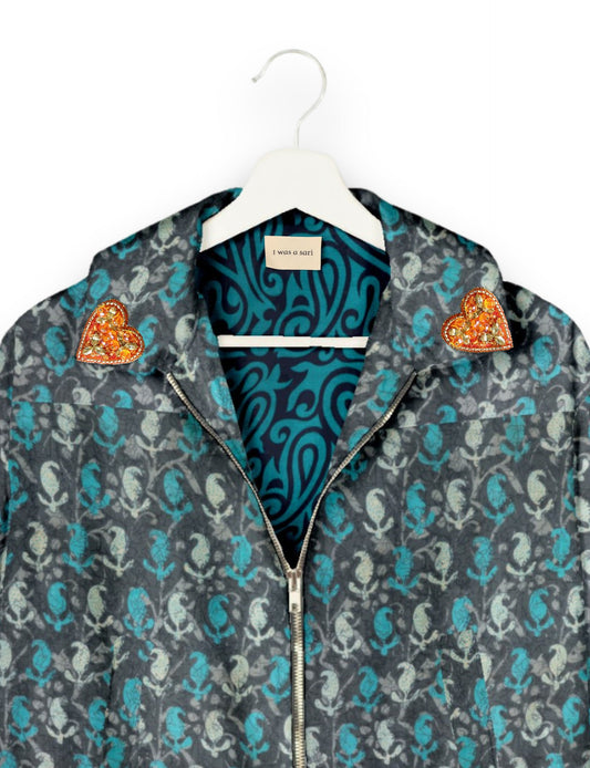 Make a bold statement with our Heart Drop Earrings, a symbol of conscious luxury and ethical fashion. Handcrafted using the intricate Aari embroidery technique, these earrings are made from upcycled sari fabric, embracing slow fashion and zero waste clothing. Elevate your look with sustainable apparel that supports fair trade fashion while reducing textile waste. Choose eco-friendly fashion that speaks of love, artistry, and responsibility.