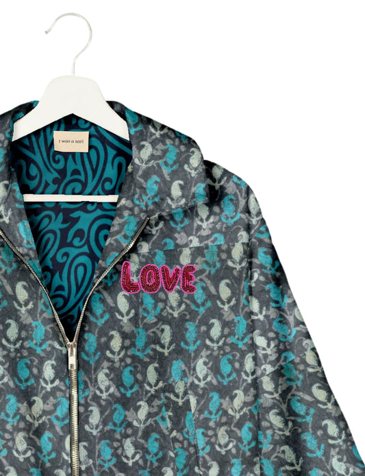 Love Bomber Jacket made from recycled fabric, featuring hand-stitched Aari embroidery. A unique piece of zero-waste clothing, part of the circular fashion movement. Designed with upcycled materials for a stylish yet environmentally friendly clothing choice.