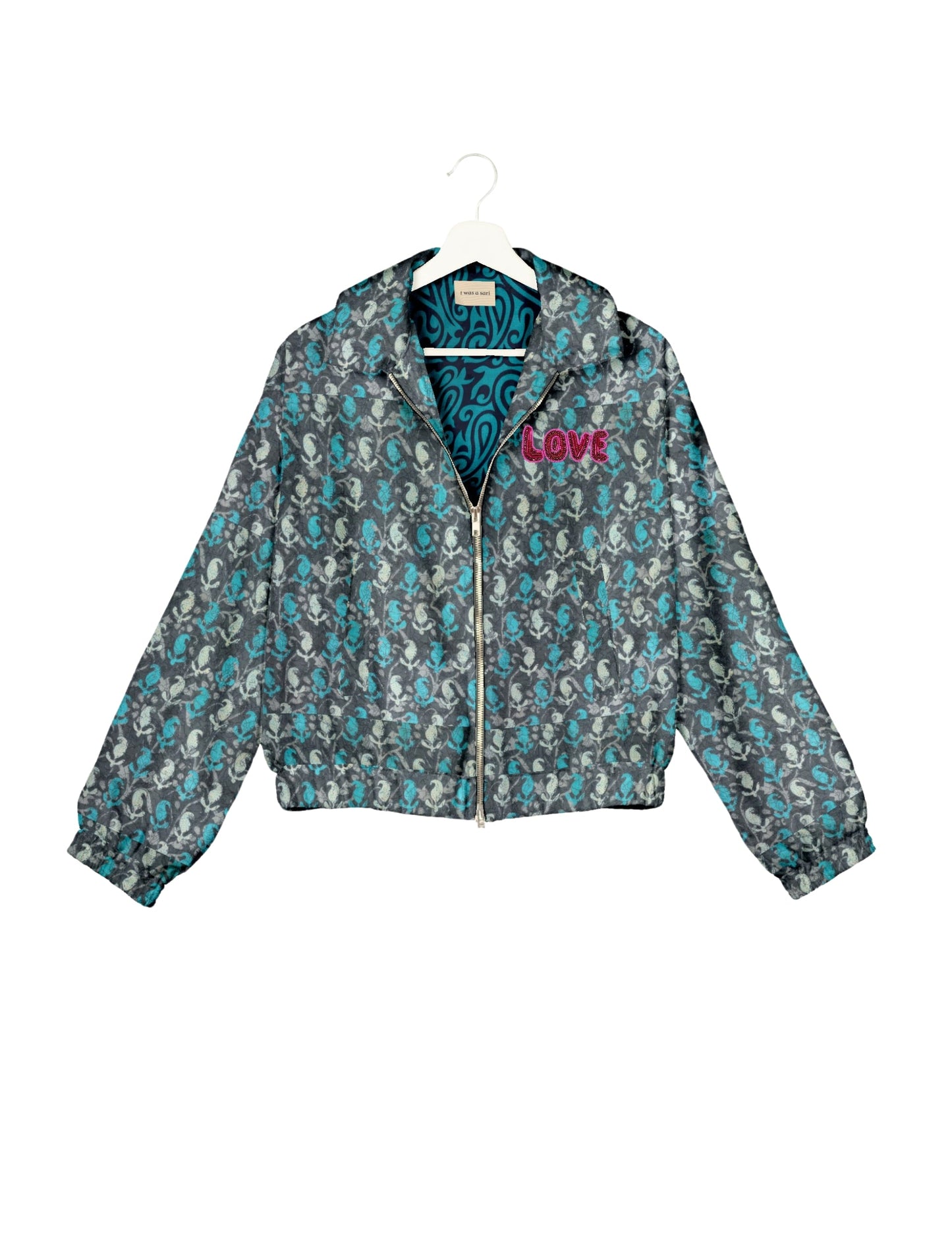 Love Bomber Jacket made from recycled fabric, featuring hand-stitched Aari embroidery. A unique piece of zero-waste clothing, part of the circular fashion movement. Designed with upcycled materials for a stylish yet environmentally friendly clothing choice.