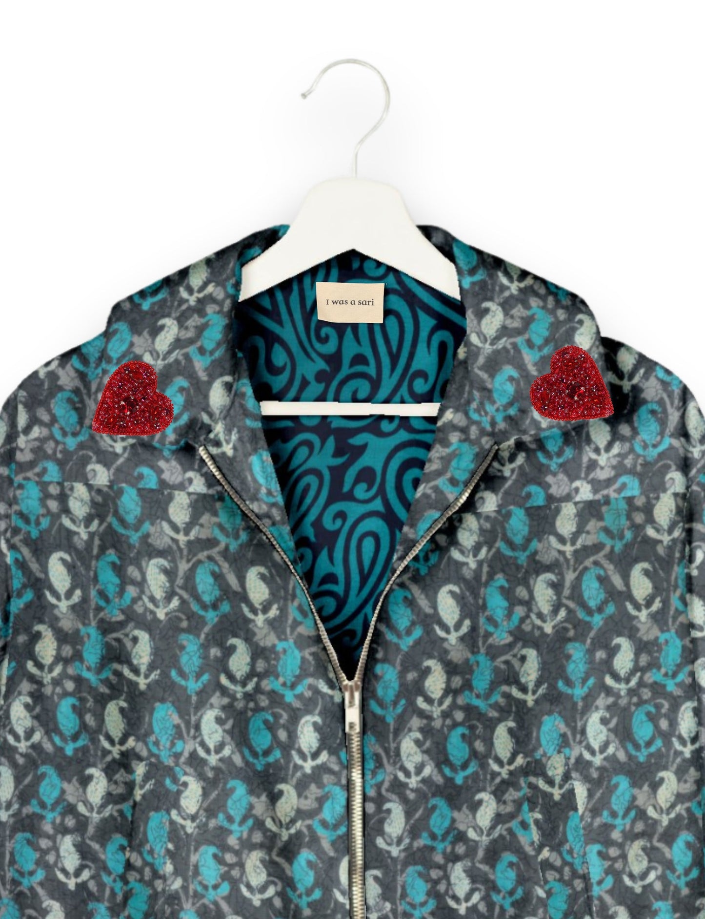 Make a bold statement with our Heart Drop Earrings, a symbol of conscious luxury and ethical fashion. Handcrafted using the intricate Aari embroidery technique, these earrings are made from upcycled sari fabric, embracing slow fashion and zero waste clothing. Elevate your look with sustainable apparel that supports fair trade fashion while reducing textile waste. Choose eco-friendly fashion that speaks of love, artistry, and responsibility.