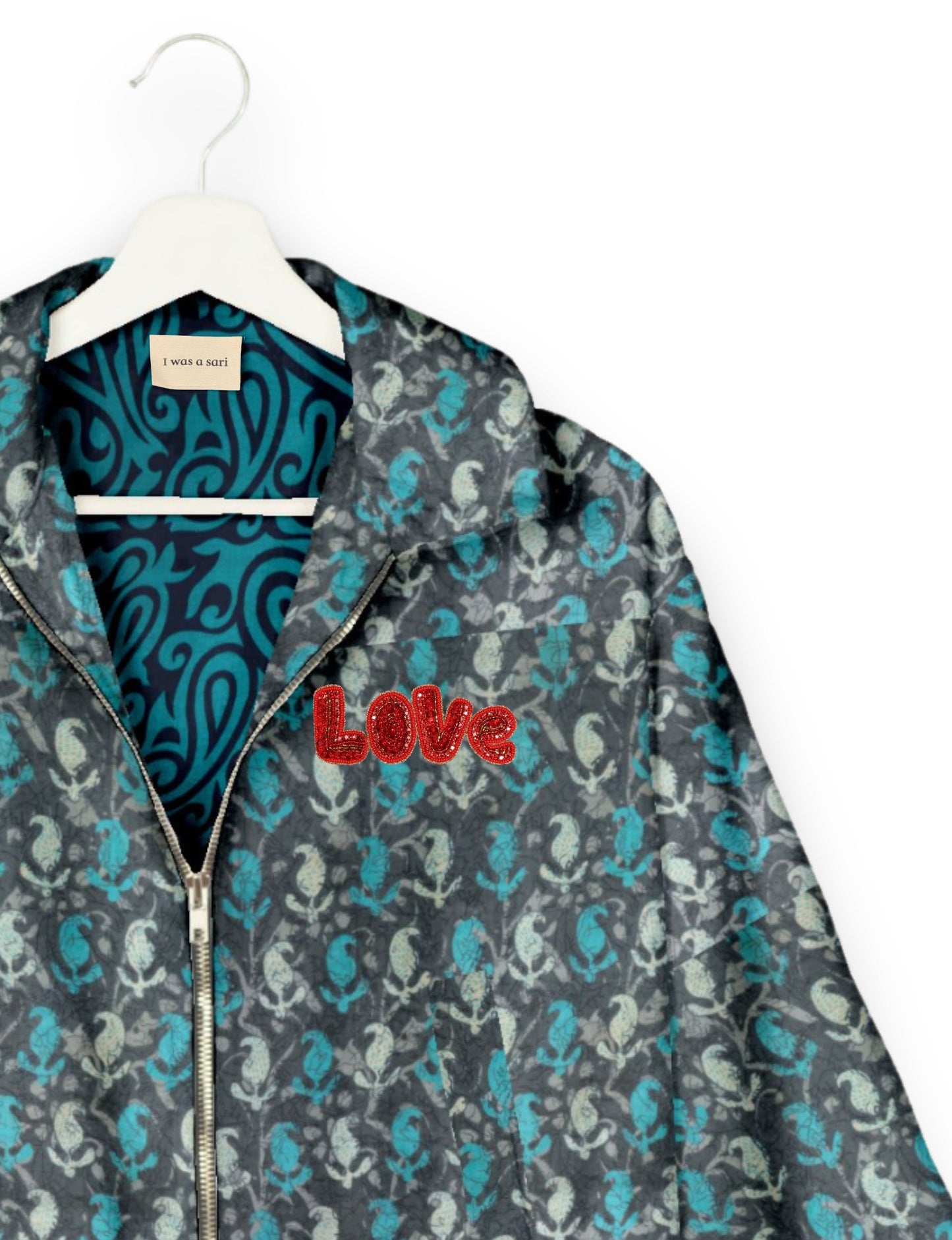 Love Bomber Jacket made from recycled fabric, featuring hand-stitched Aari embroidery. A unique piece of zero-waste clothing, part of the circular fashion movement. Designed with upcycled materials for a stylish yet environmentally friendly clothing choice.