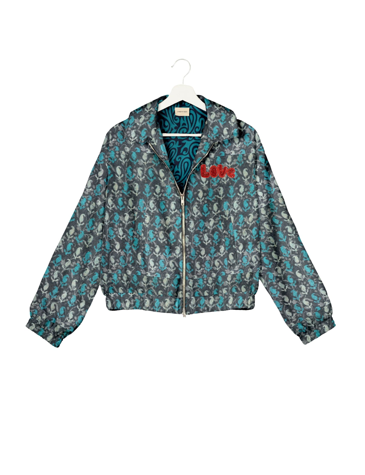 Love Bomber Jacket made from recycled fabric, featuring hand-stitched Aari embroidery. A unique piece of zero-waste clothing, part of the circular fashion movement. Designed with upcycled materials for a stylish yet environmentally friendly clothing choice.