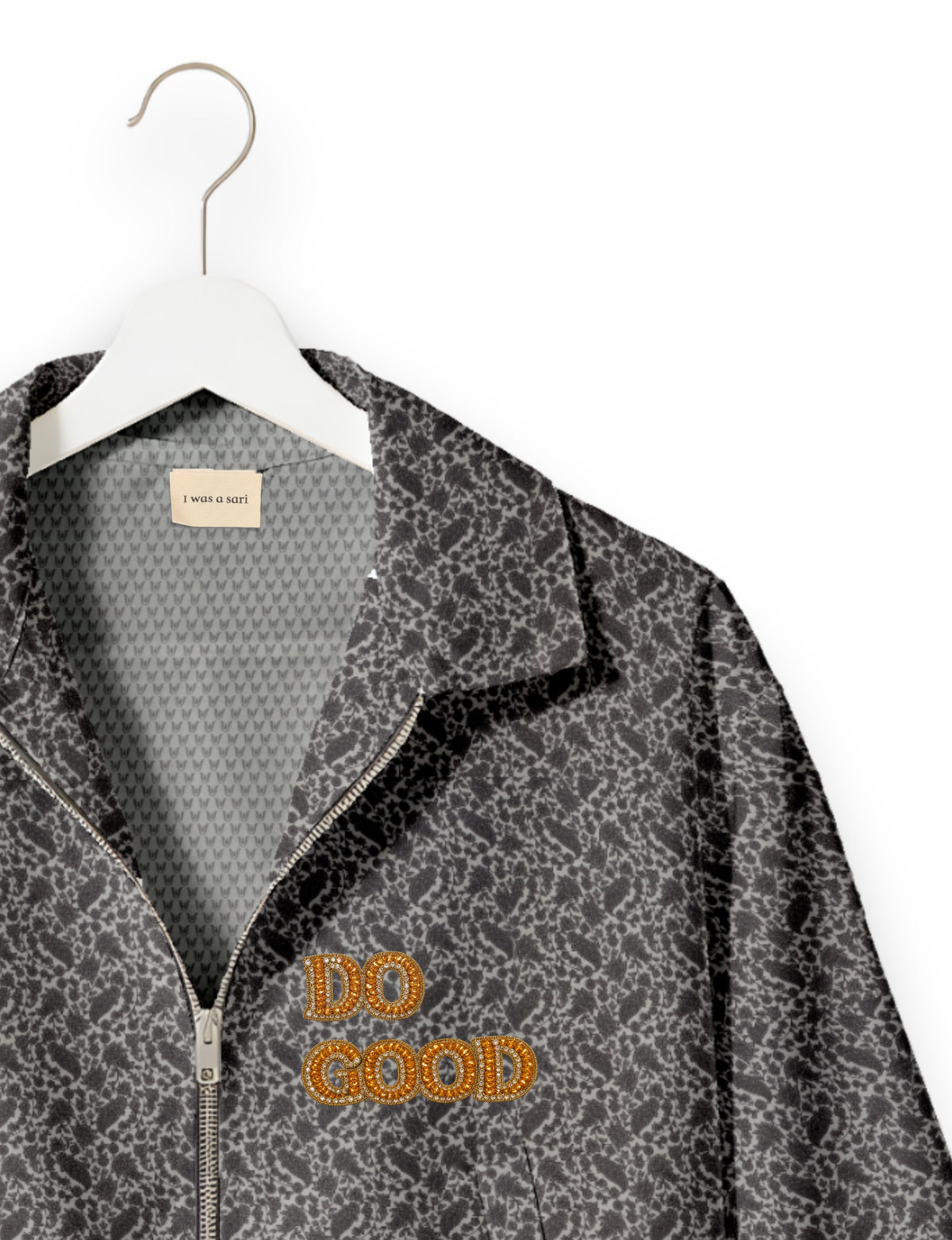 Gold cropped DO GOOD bomber jacket featuring hand-embroidered lettering on the left chest, contrasting inner lining and two functional pockets.