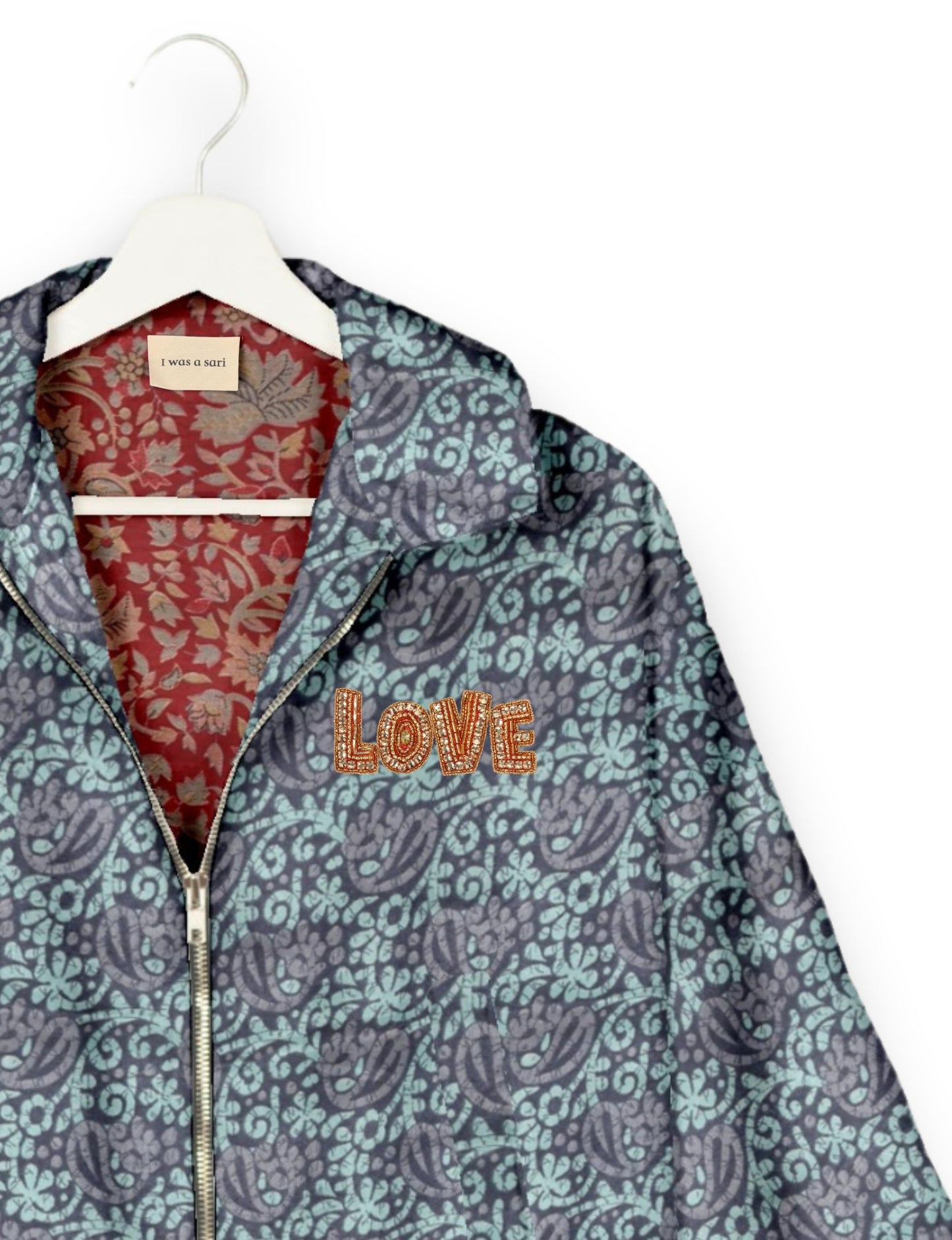 Love Bomber Jacket made from recycled fabric, featuring hand-stitched Aari embroidery. A unique piece of zero-waste clothing, part of the circular fashion movement. Designed with upcycled materials for a stylish yet environmentally friendly clothing choice.