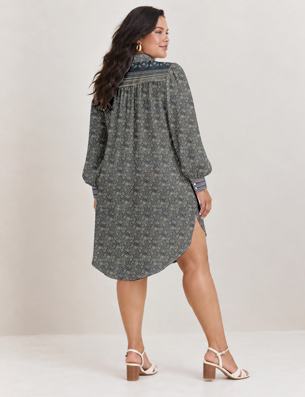 High low shirt with a relaxed fit, button-down front, classic collar, gathered shoulders and full-length blouson sleeves.